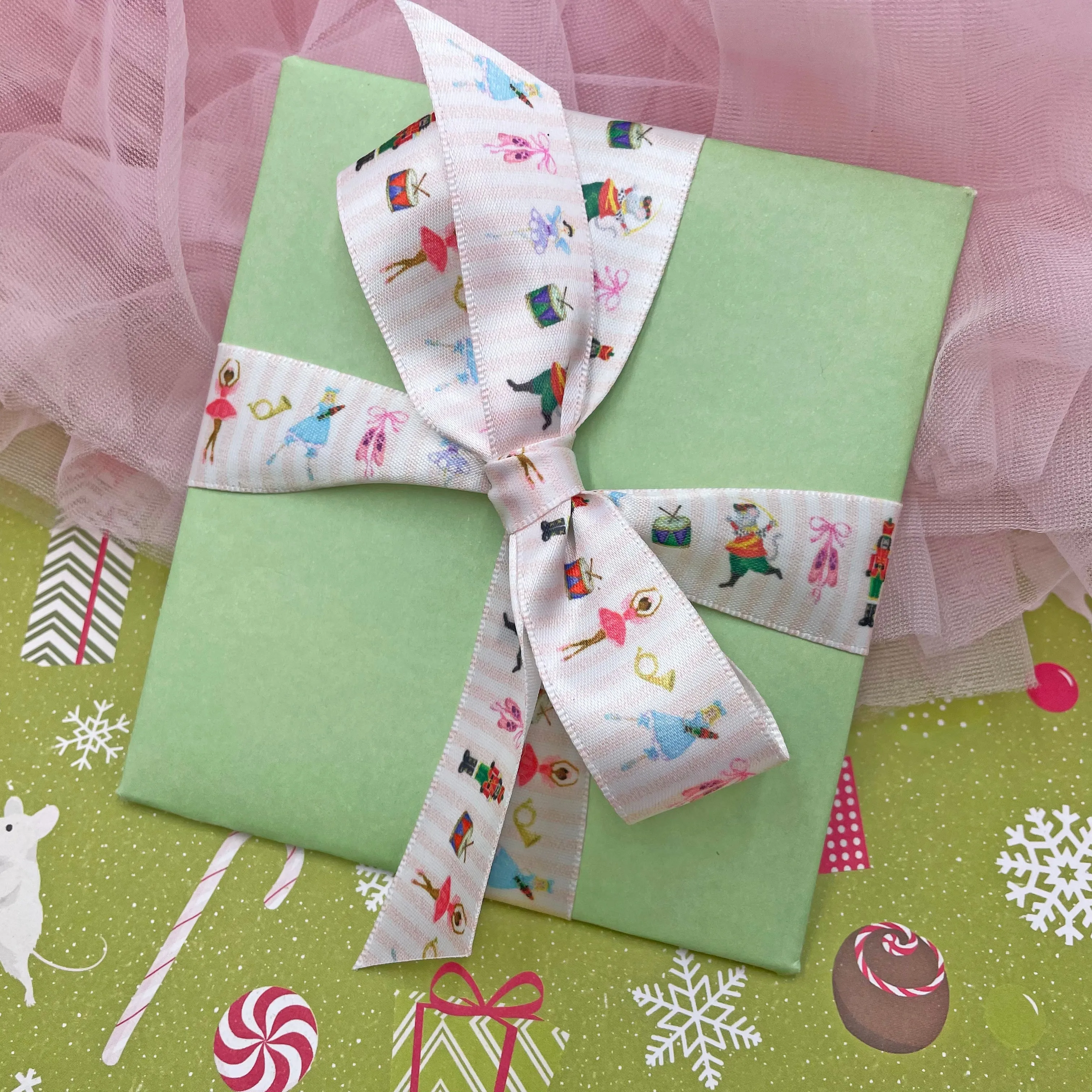 Nutcracker Ballet ribbon featuring all the characters printed on 5/8", 7/8" and 1.5" white satin